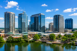 Commercial office buildings along a waterfront cityscape